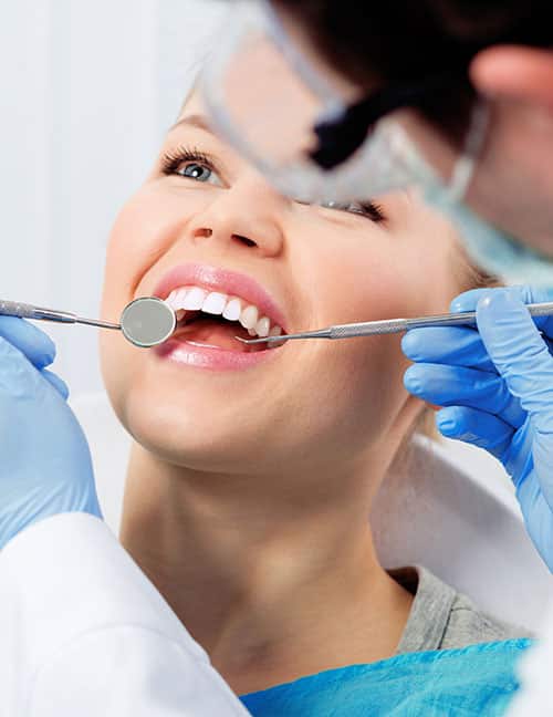 Dentist Checking Up Patient — Pain Free Dental Clinic In Moss Vale, NSW