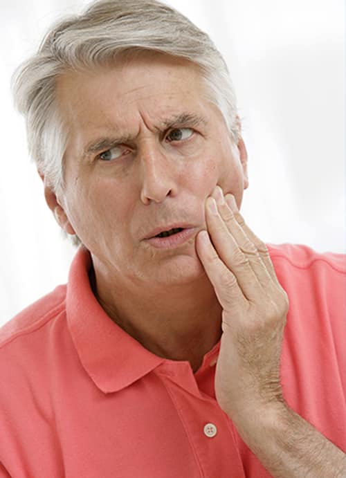 Man With A Toothache — Pain Free Dental Clinic In Moss Vale, NSW