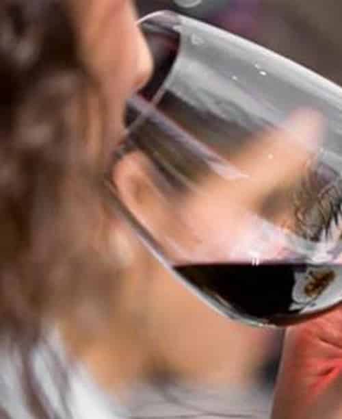 Woman Drinking Wine — Pain Free Dental Clinic In Moss Vale, NSW