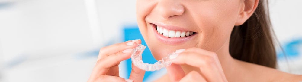 Woman Holding A Invisalign