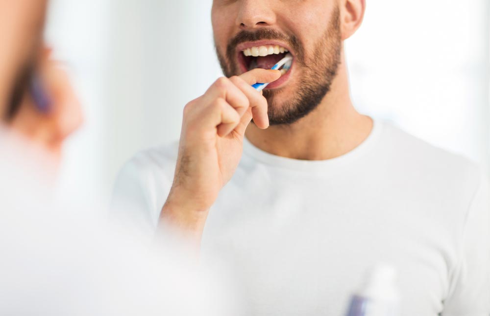 Man Brushing His Teeth